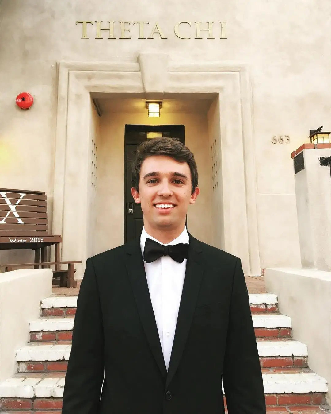 tuxedo portrait at house entrance