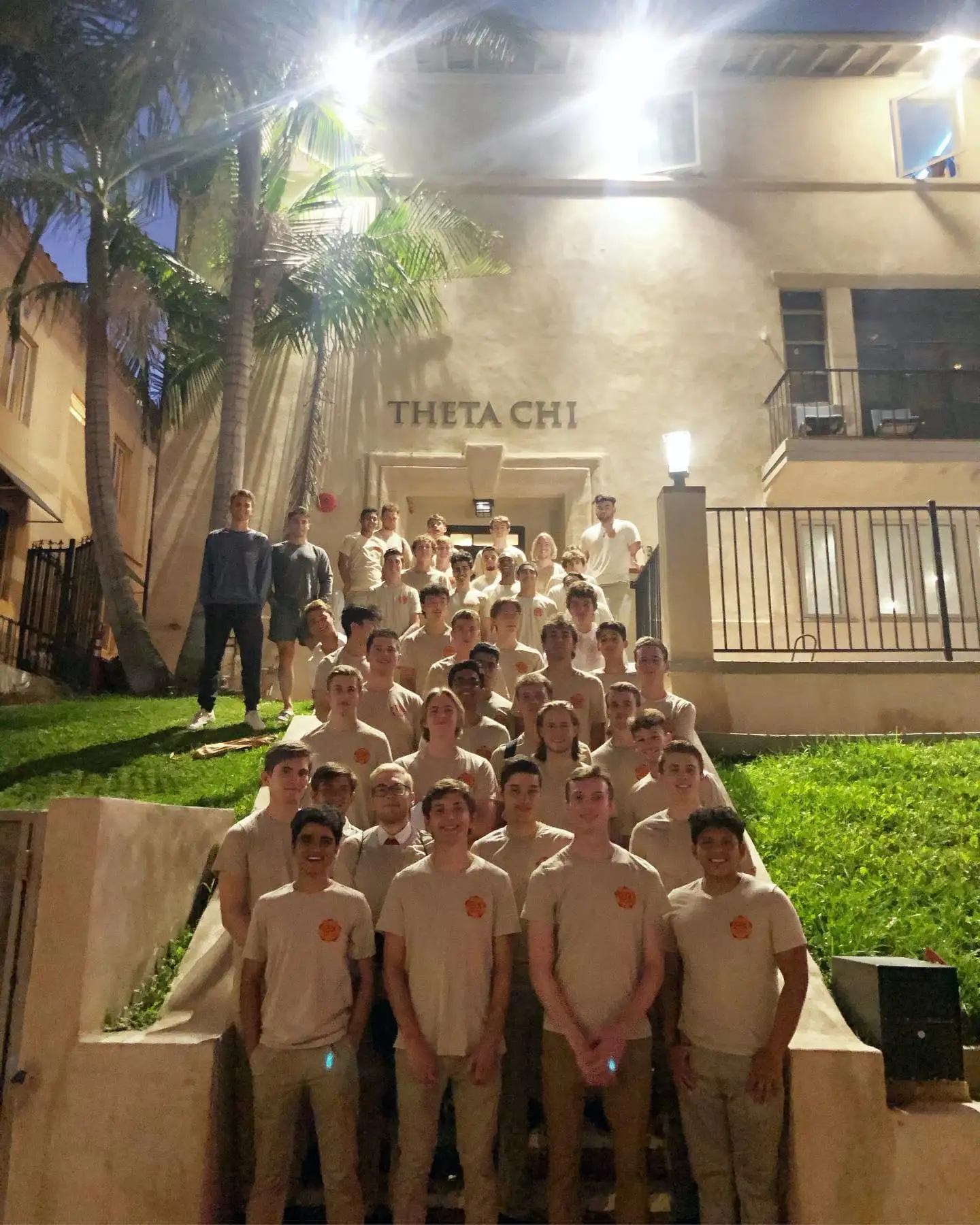 pledge class lined up at house at night