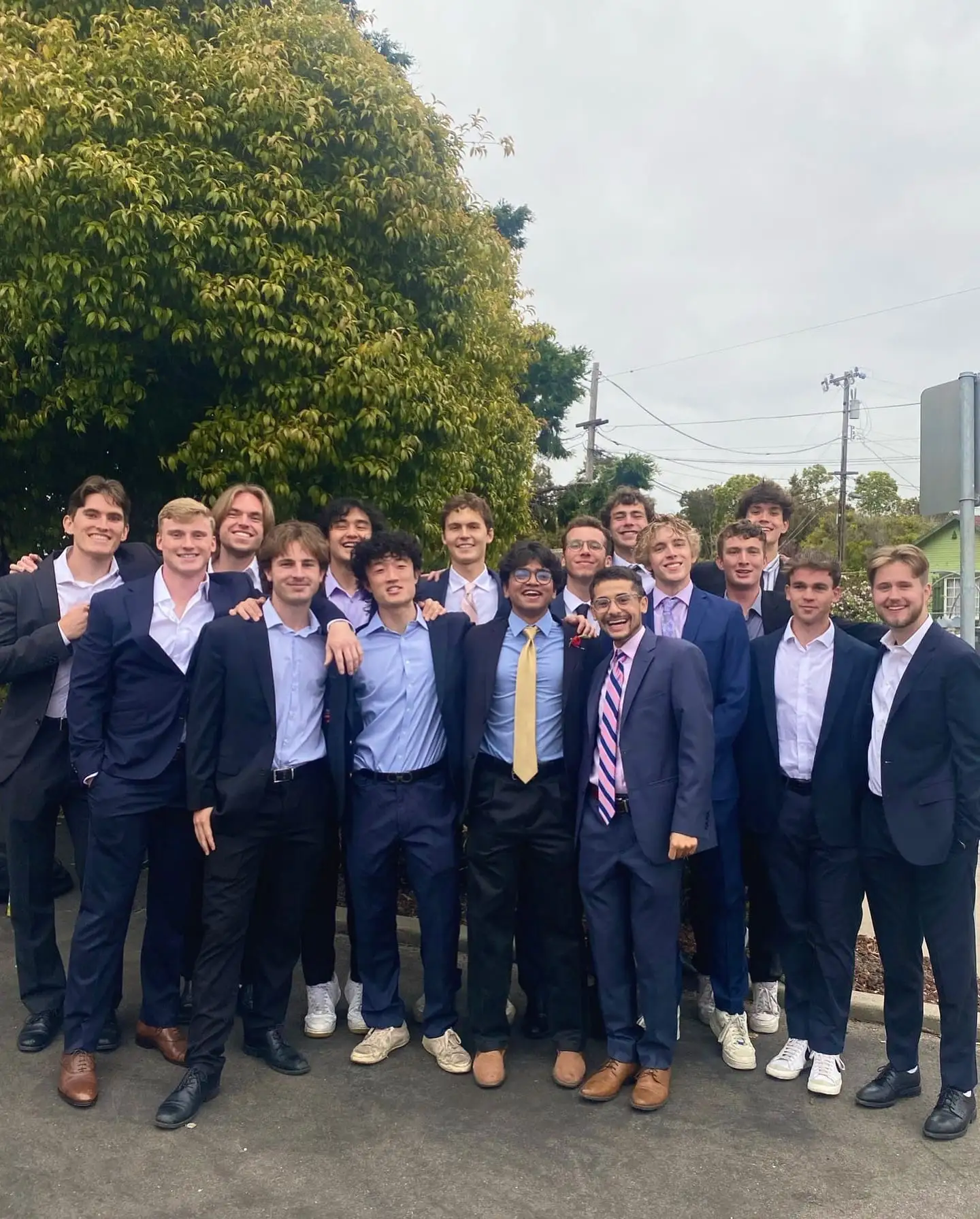 large chapter group in suits outdoors