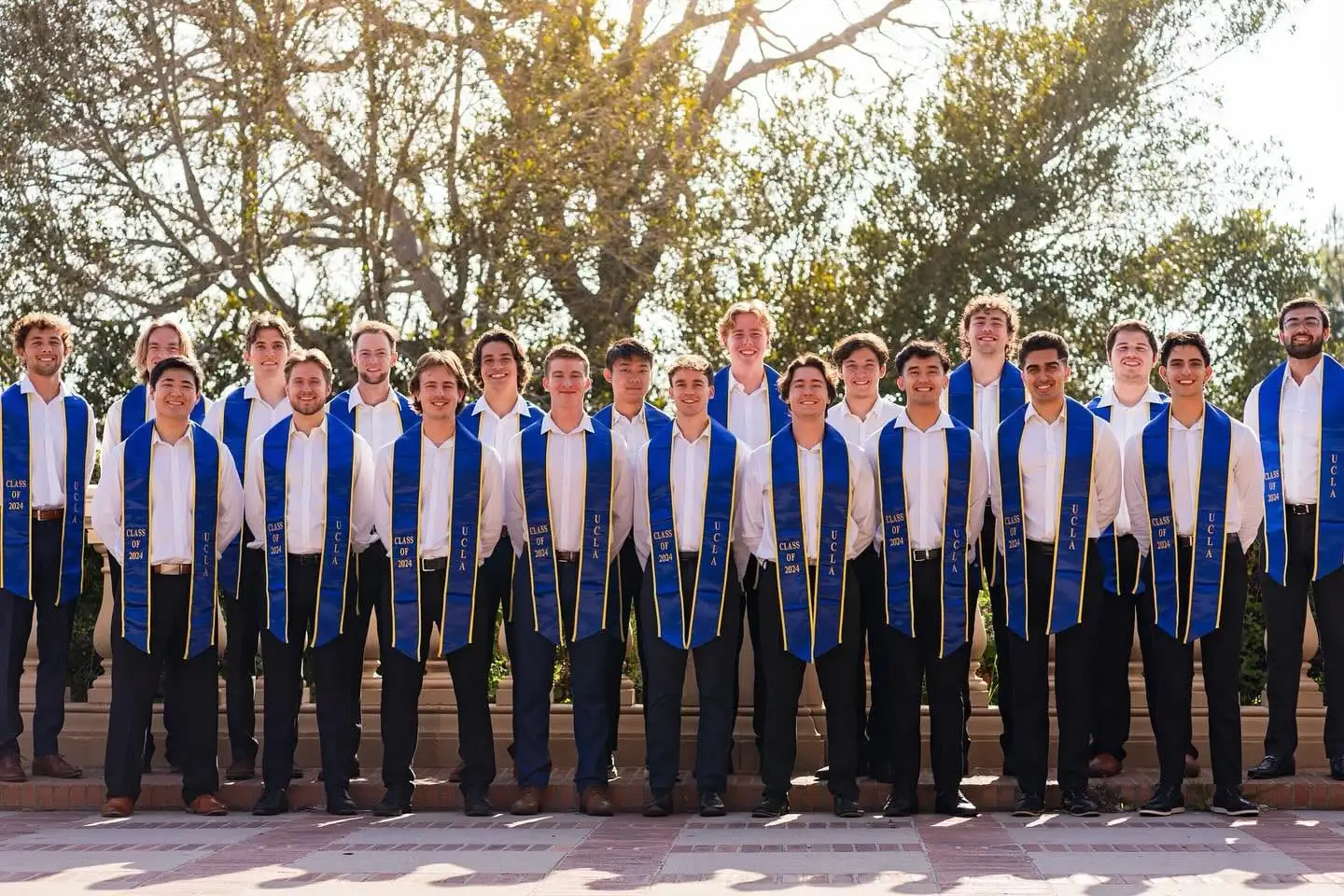 graduates in stoles, full group lineup