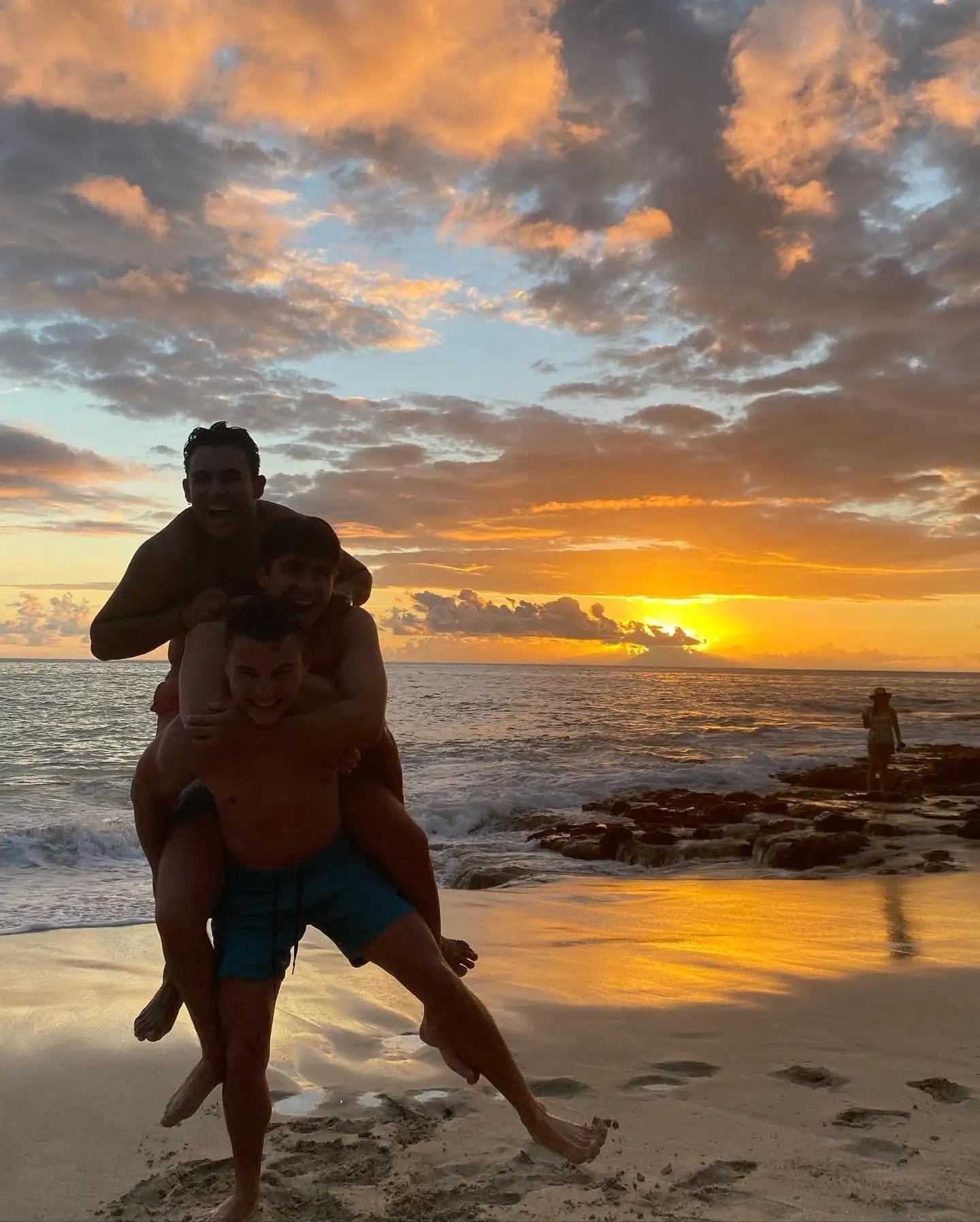 sunset beach piggyback fun