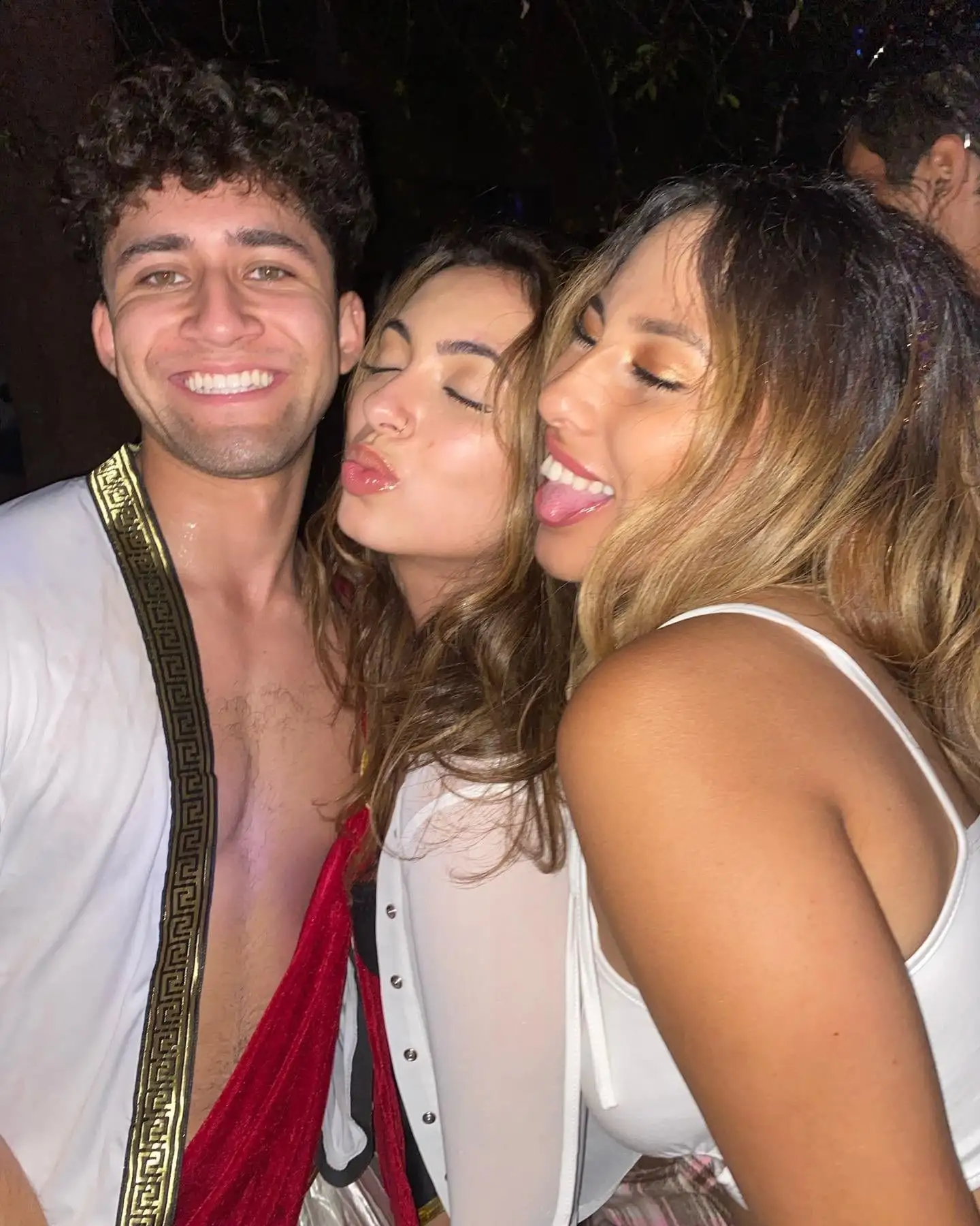 Three brothers in togas with big smiles