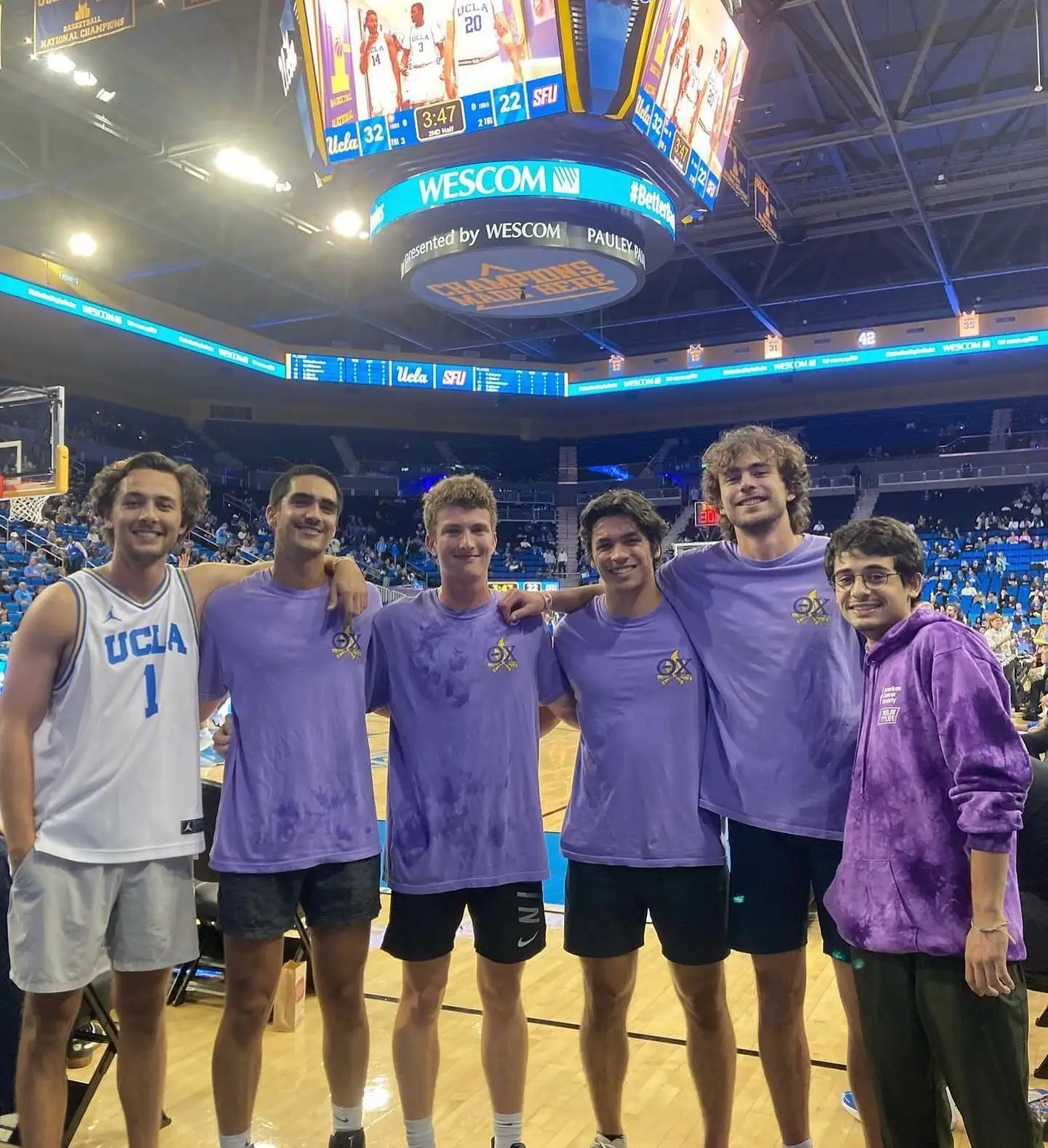 brothers courtside at UCLA basketball